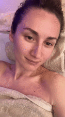 Woman enjoys spa treatment in ambient-lit wellness facility