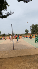 Youth sports gathering in green tracksuits at Nigerian facility