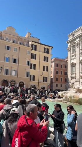 Routine morning activity documented around Rome's Trevi Fountain district