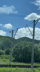Train passenger films rural Russian countryside near Podkumok