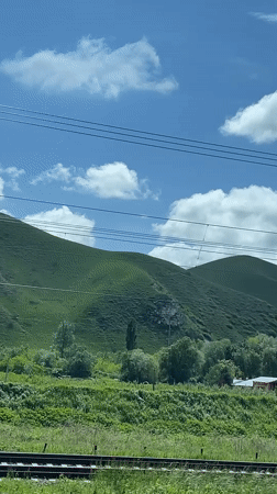 Train passenger films rural Russian countryside near Podkumok