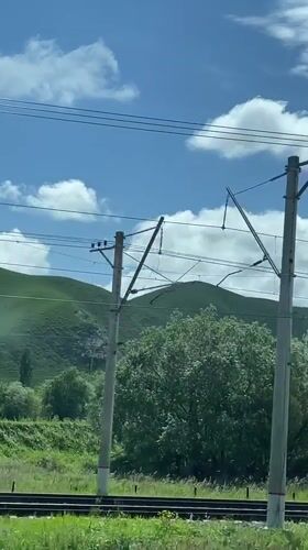 Train passenger films rural Russian countryside near Podkumok