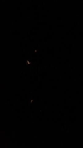 The video is almost entirely black, briefly revealing a white, skull-like shape with dark eye sockets, before returning to darkness. A scream is heard as the image flashes.