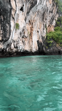 Limestone karsts and turquoise water at Haad Hin Khom