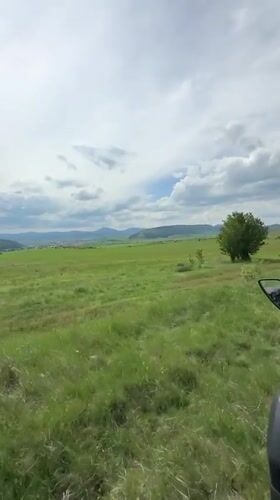 Motorcyclist rides through field near Breznik, Bulgaria