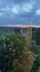Evening cityscape observed with colorful sky during twilight hours