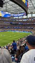 Soccer match underway in Los Angeles stadium, 3-0 score