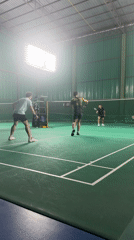 Indoor badminton match underway at a Ko Samui court