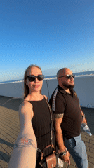 Couples document afternoon stroll along Sirius walkway
