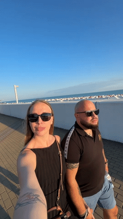 Couples document afternoon stroll along Sirius walkway
