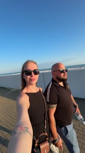 Couples document afternoon stroll along Sirius walkway