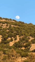 Full moon photographed over Fethiye mountains, Turkey afternoon