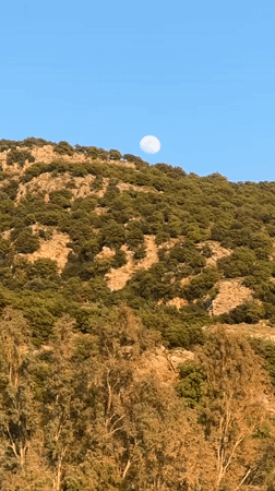 Full moon photographed over Fethiye mountains, Turkey afternoon
