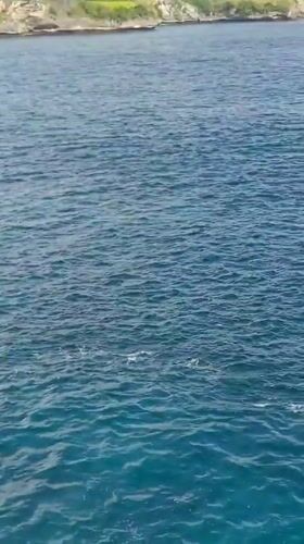 Tourist captures scenic clifftop views in Nusa Penida, Indonesia