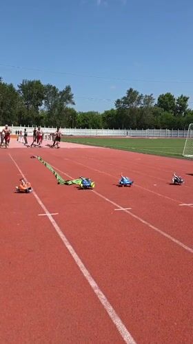Harness sled pulls on a red track in Angarsk