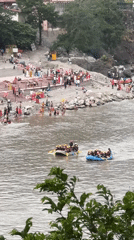 River rafting groups navigate waters near Rishikesh, India