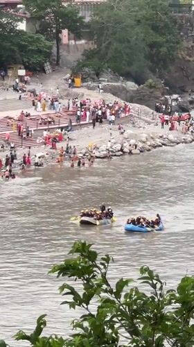 River rafting groups navigate waters near Rishikesh, India