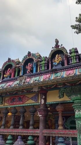 Batu Caves: golden statue, colorful stairs, and roaming macaques