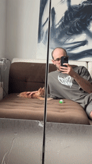 Man and kitten share quiet moment in Khimki apartment
