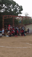 Community baseball game draws crowds with music and socializing