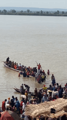River transport activity observed near Lokoja with crowded passenger boats