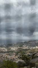 Overcast skies with sunlight patches observed over Benalmádena coastline