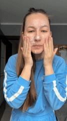 Woman documents morning skincare routine with cat bath in Tyumen