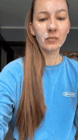 Woman documents morning skincare routine with cat bath in Tyumen