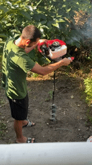 Post holes being drilled in a Plovdiv backyard one morning