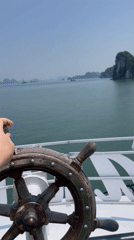 Steering through island-dotted waters off northern Vietnam
