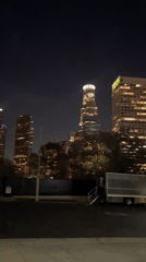 Night view captures illuminated LA skyline including U.S. Bank Tower
