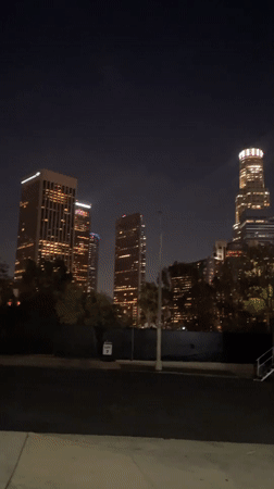 Night view captures illuminated LA skyline including U.S. Bank Tower
