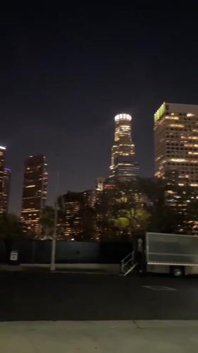 Night view captures illuminated LA skyline including U.S. Bank Tower