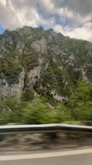 Car travels through Montenegro mountains, tunnel passage observed
