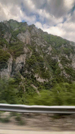 Car travels through Montenegro mountains, tunnel passage observed
