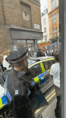 Teenagers queue at London vintage store under police supervision