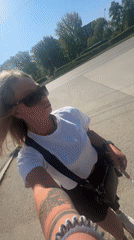 Woman records selfie video on sunny morning in Perm