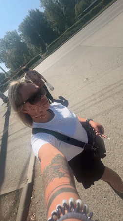 Woman records selfie video on sunny morning in Perm