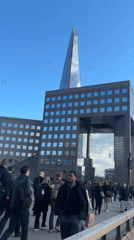 Clear skies frame London's Shard in busy daytime scene