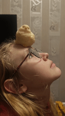 Woman poses with small yellow object on forehead in Samara