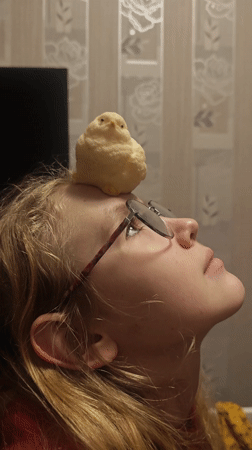 Woman poses with small yellow object on forehead in Samara
