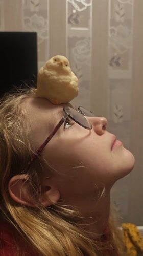 Woman poses with small yellow object on forehead in Samara