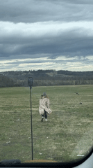 Woman films personal video in Russian field near Popelkovo