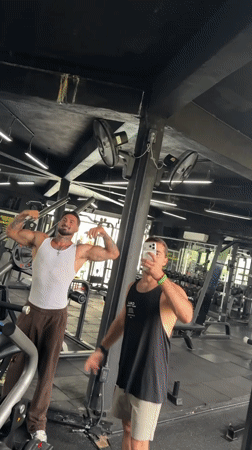 Two men take selfie video at Ratsada gym