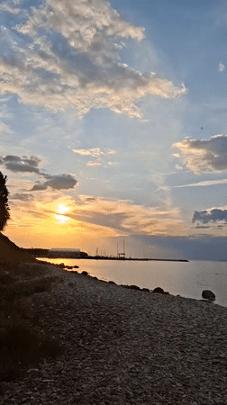 Unknown witness documents golden hour sunset along Tallinn coastline