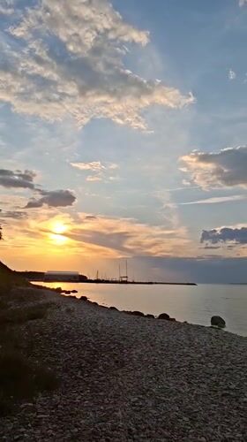 Unknown witness documents golden hour sunset along Tallinn coastline