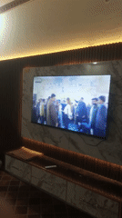 Wedding celebration broadcasts on TV in Pakistani home