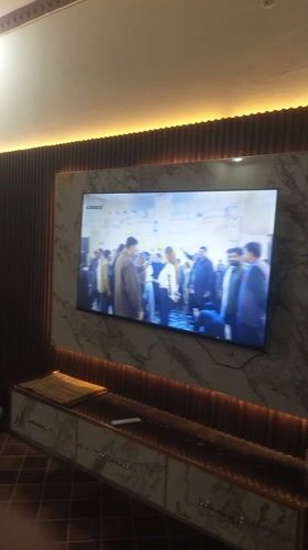Wedding celebration broadcasts on TV in Pakistani home