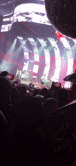 Live band performs under red and pink lights in Jūrmala