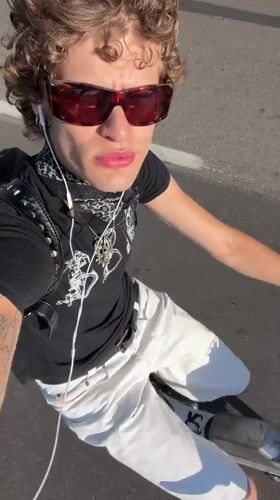Young scooter rider spotted on Milan street
